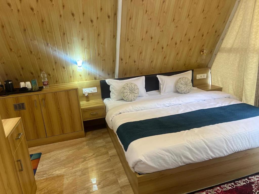 a bedroom with a large bed in a room at thesukoon in Bhīm Tāl