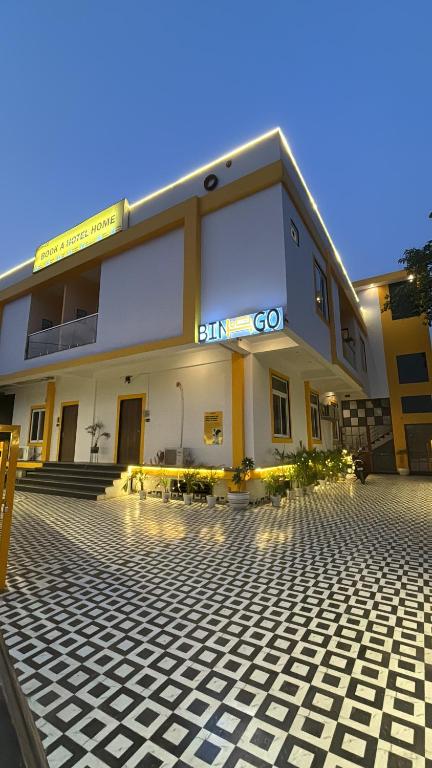 a building with a tile courtyard in front of it at Bingo Service Apartment Grand 3BHK in Alwar