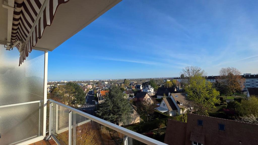 a view of a city from a balcony at Le haie vigné in Caen