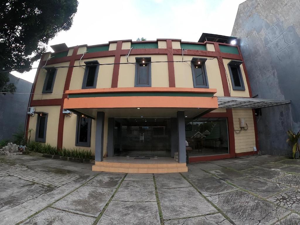 a building with a lot of windows on it at Hotel Mario Parepare in Parepare
