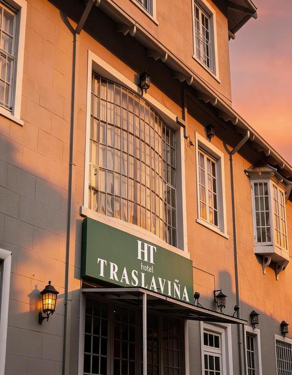 a building with a hir next to a train station at Hotel Traslaviña in Viña del Mar