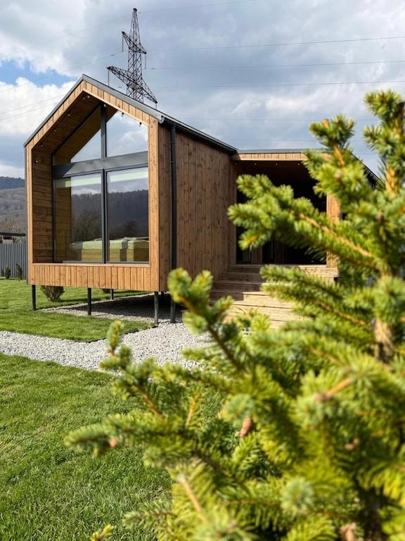 a house with a large window on the side of it at Nest house in Skole