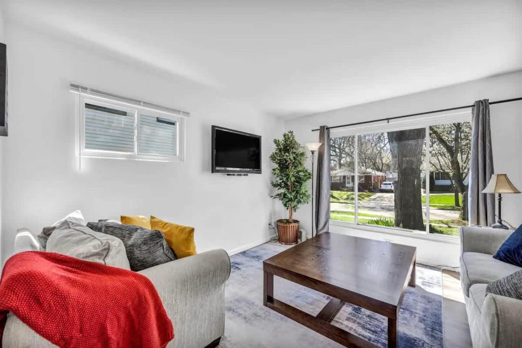 a living room with a couch and a table at 113 Madison Ave, Cuyahoga Falls in Cuyahoga Falls