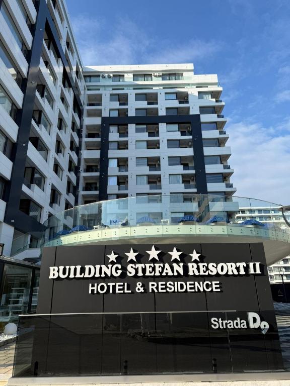 a building with a sign for a hotel and residence at Building Stefan Resort 2 Mamaia Nord - Studio 804 in Năvodari