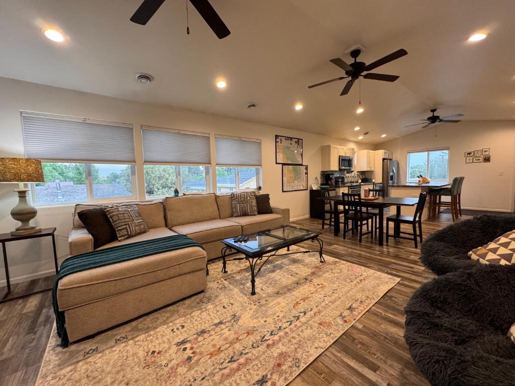 a living room with a couch and a table at Relaxing 3BR 2 En Suites, Bikes & Helmets in Sheridan