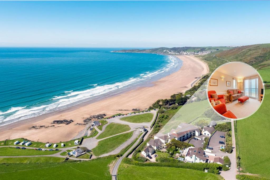 an aerial view of a house with a beach at 3 Bed in Putsborough oc-flt20 in Croyde