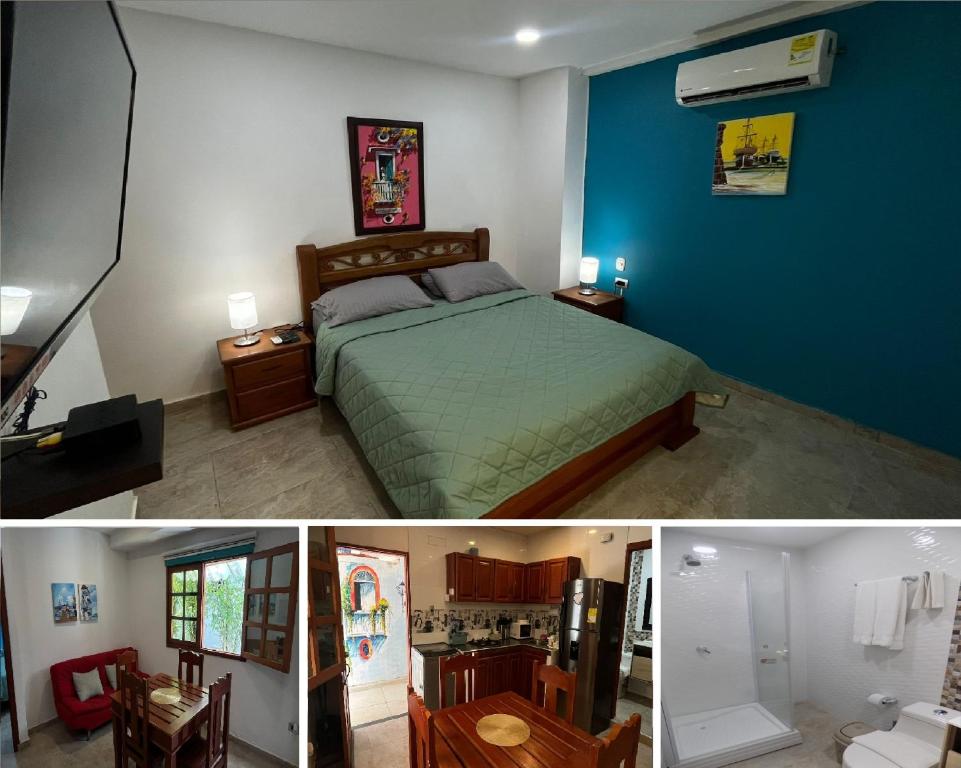 a bedroom with a bed and a blue wall at APARTAMENTOS DECOR in Cartagena de Indias