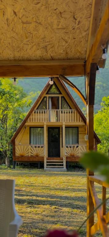 a large wooden house with a large window at Lakarido in Tsesi