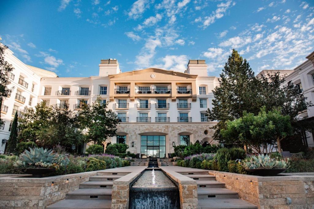 a building with a fountain in front of it at Signia by Hilton La Cantera Resort & Spa in San Antonio