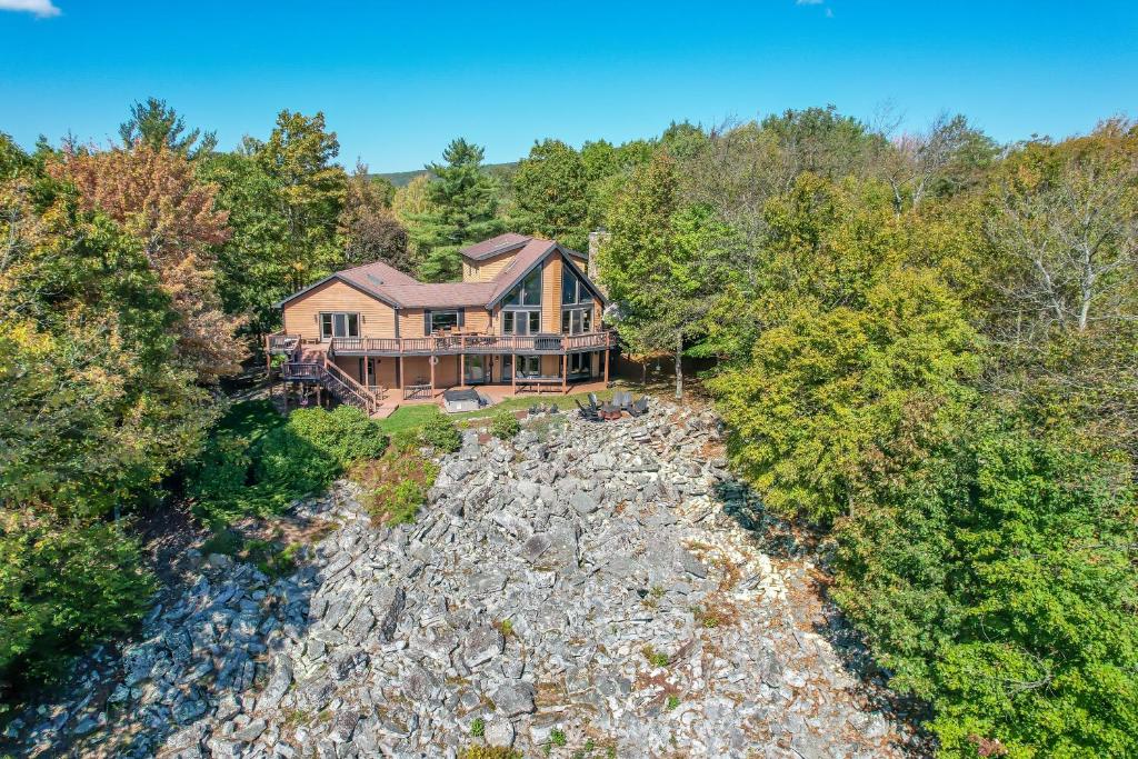 an aerial view of a house in the woods at New: Lake Access with Dock Slip More in Swanton