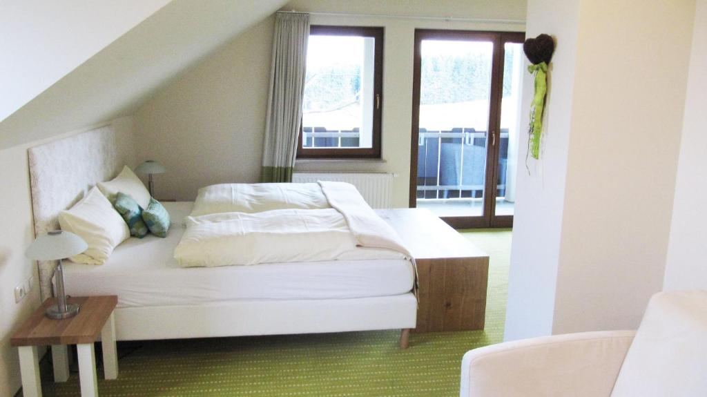 Postel nebo postele na pokoji v ubytování Berggasthof & Hotel Sennhütte