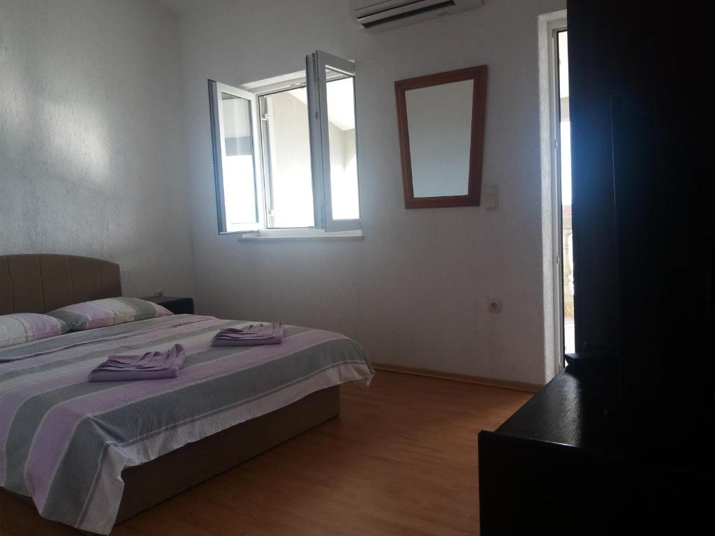 Posteľ alebo postele v izbe v ubytovaní Apartments Cajic