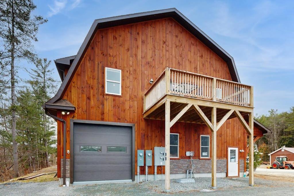 a large wooden barn with a garage at Valley Vista Vacay 2 in Littleton