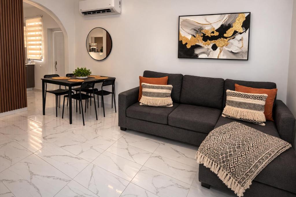 a living room with a couch and a table at La Casita del Este in Fajardo