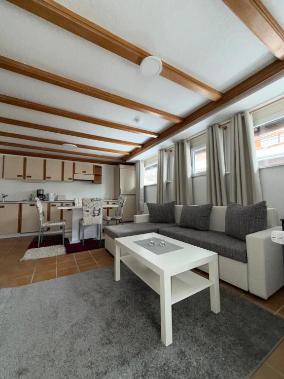a living room with a couch and a table at Ferienhaus HANA in St. Blasien