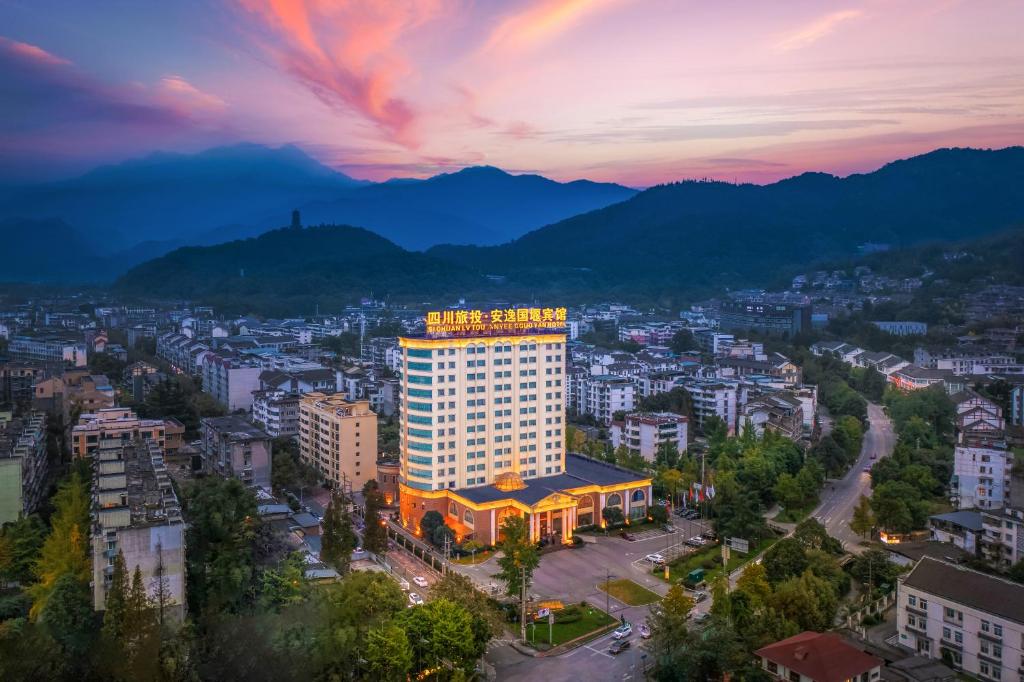 an aerial view of a city at sunset at 都江堰国堰宾馆 in Dujiangyan