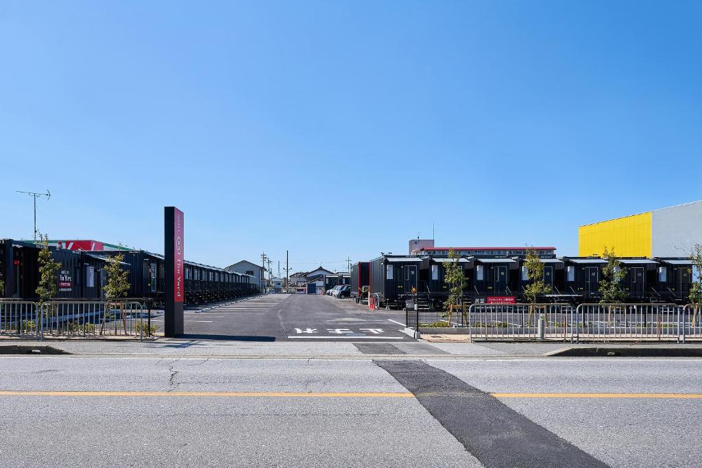 an empty street with a bridge in a city at HOTEL R9 The Yard Nagahamainter in Nagahama