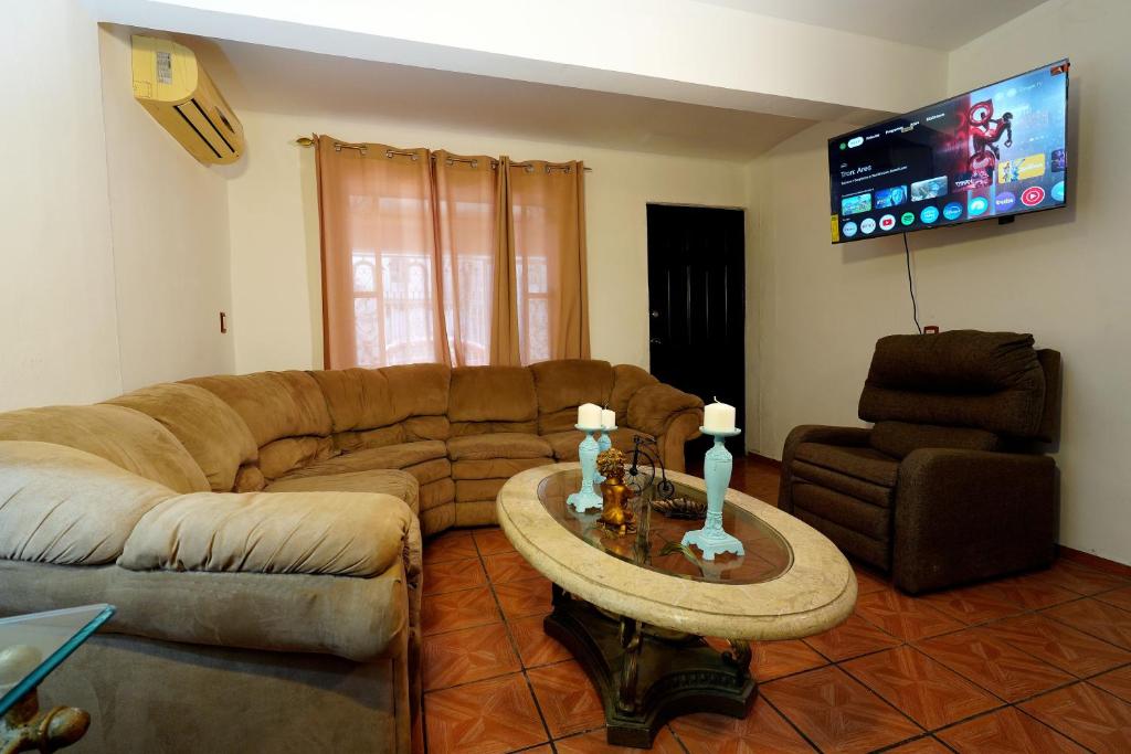 a living room with a couch and a table at Ribera Dorada in Monterrey