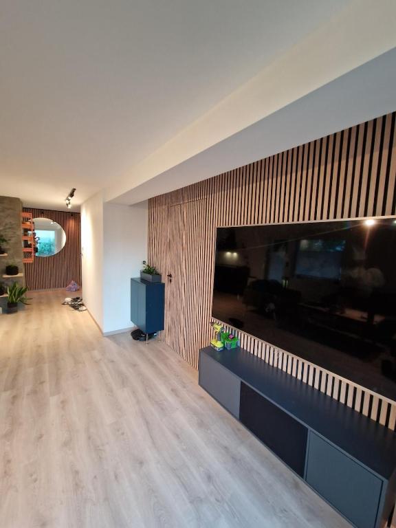 a living room with a large flat screen tv at Aurora Central Premium Apartment II, Bodø in Bodø