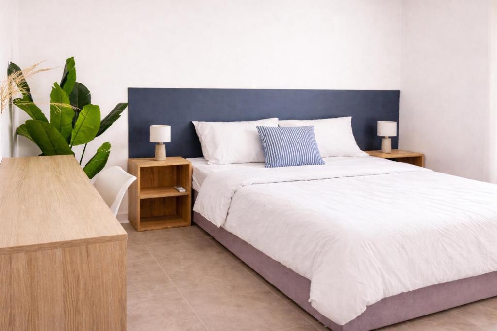 a bedroom with a large bed and two night stands at La Maison d'Isa in Albion