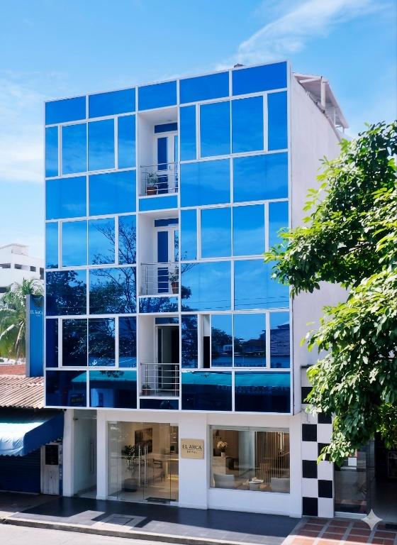 an office building with blue glass windows at Hotel Azulejo del Llano in Yopal