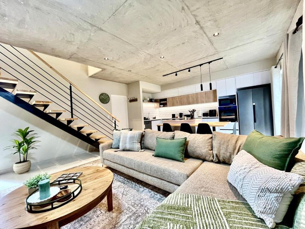 a living room with a couch and a table at Rustic Hills #30 in Swakopmund