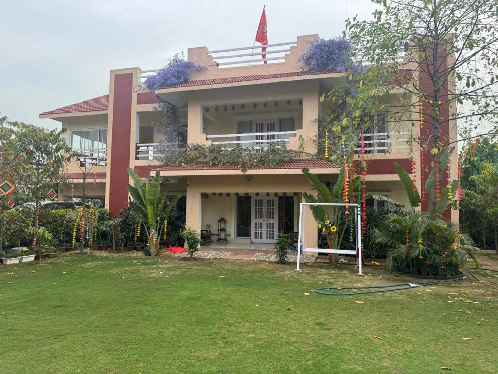 a house with a lawn in front of it at Golden Villas in Rewāri