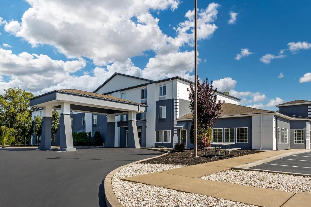 a large white building with a parking lot at Comfort Inn & Suites Harrisburg-Hershey North in Manor Acres