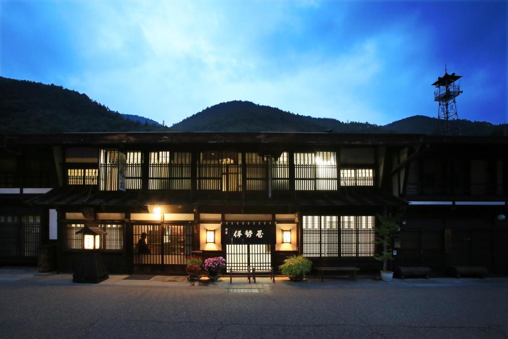 a building with a sign on the front of it at Oyado Iseya in Shiojiri