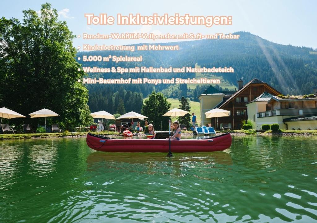 a group of people in a boat on the water at Kinderhotel Stegerhof in Donnersbachwald