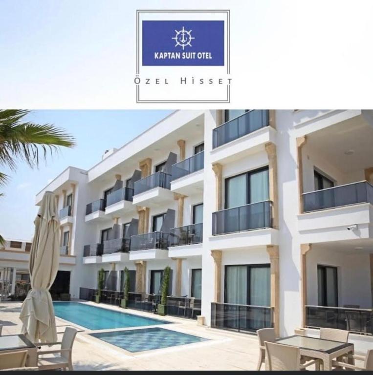 a villa with a swimming pool and a hotel at Taşucu Kaptan Suit Otel in Silifke