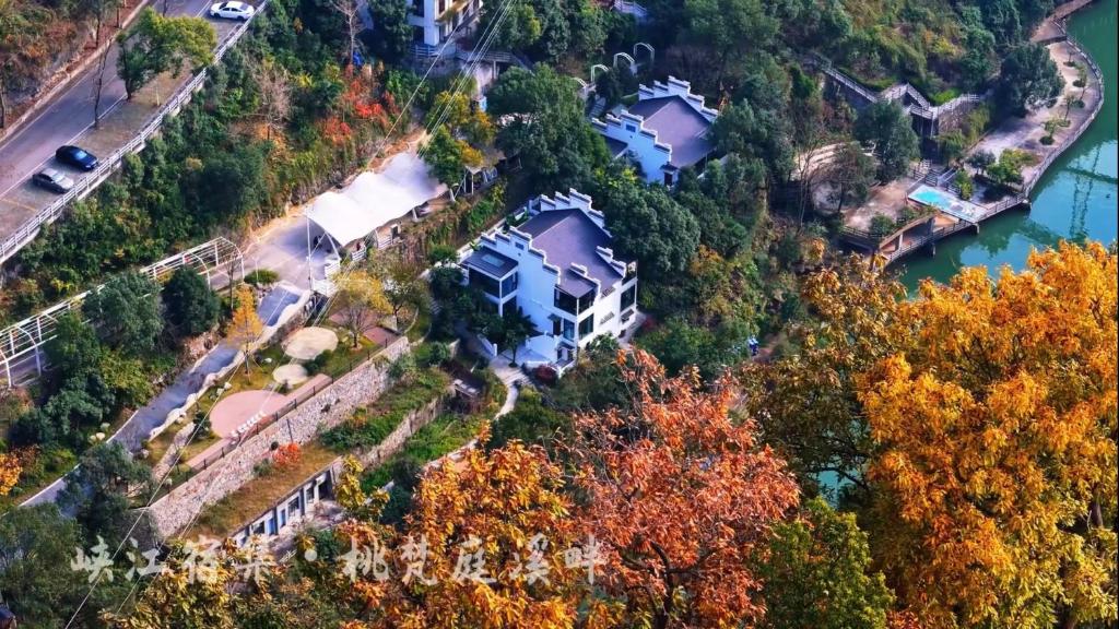 an aerial view of a house on a hill next to a river at Taofanting Riverside Hotel in Yichang