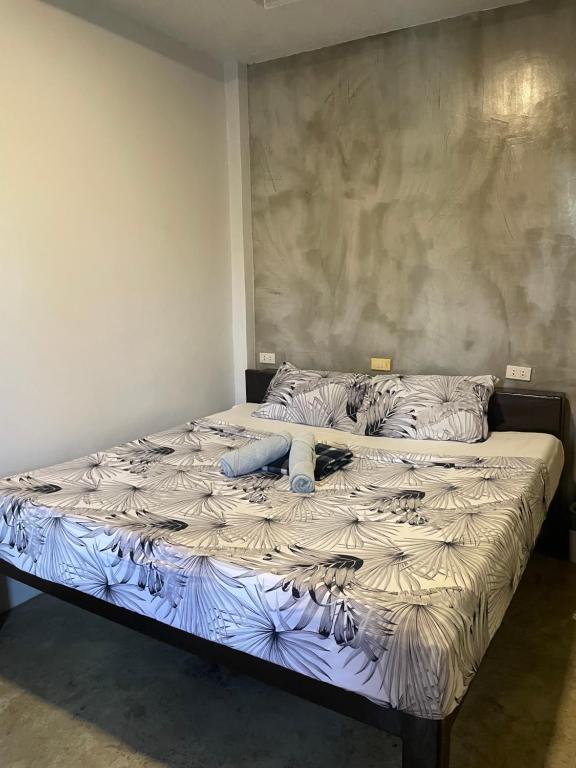 a large bed sitting in a room with at jbsurf House in Catagnan