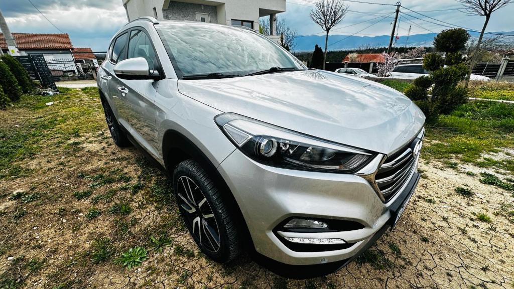 a silver car is parked in a yard at Rent a Car Cipo in Kumanovo