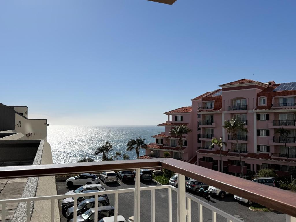 a view of the ocean from the balcony of a building at Madeira Bliss II Prime Location with Pool and Parking in Funchal