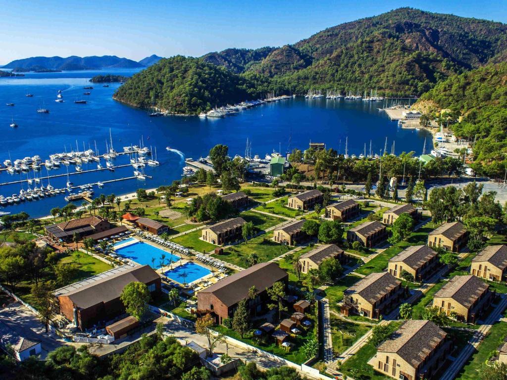 an aerial view of a resort with a marina at Rixos Premium Göcek - Adult Only in Göcek