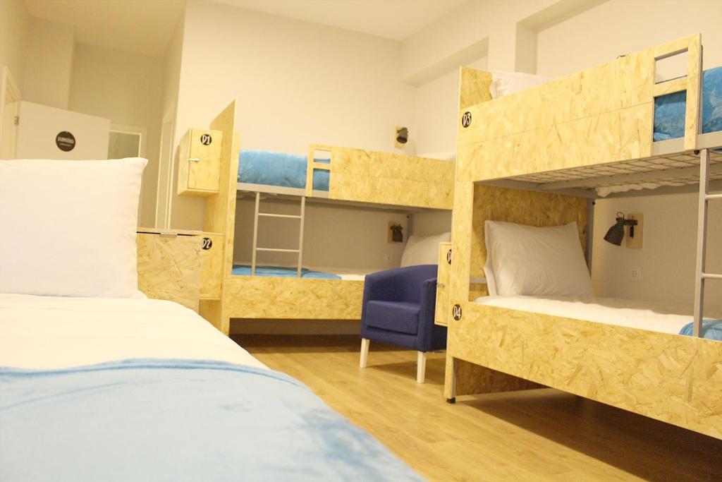 Postel nebo postele na pokoji v ubytování HI!GO