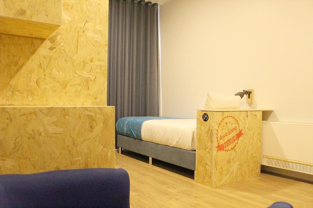 Postel nebo postele na pokoji v ubytování HI!GO