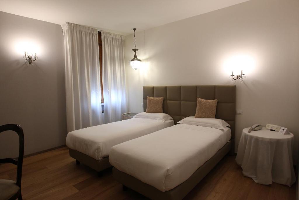Postel nebo postele na pokoji v ubytování Hotel Globo