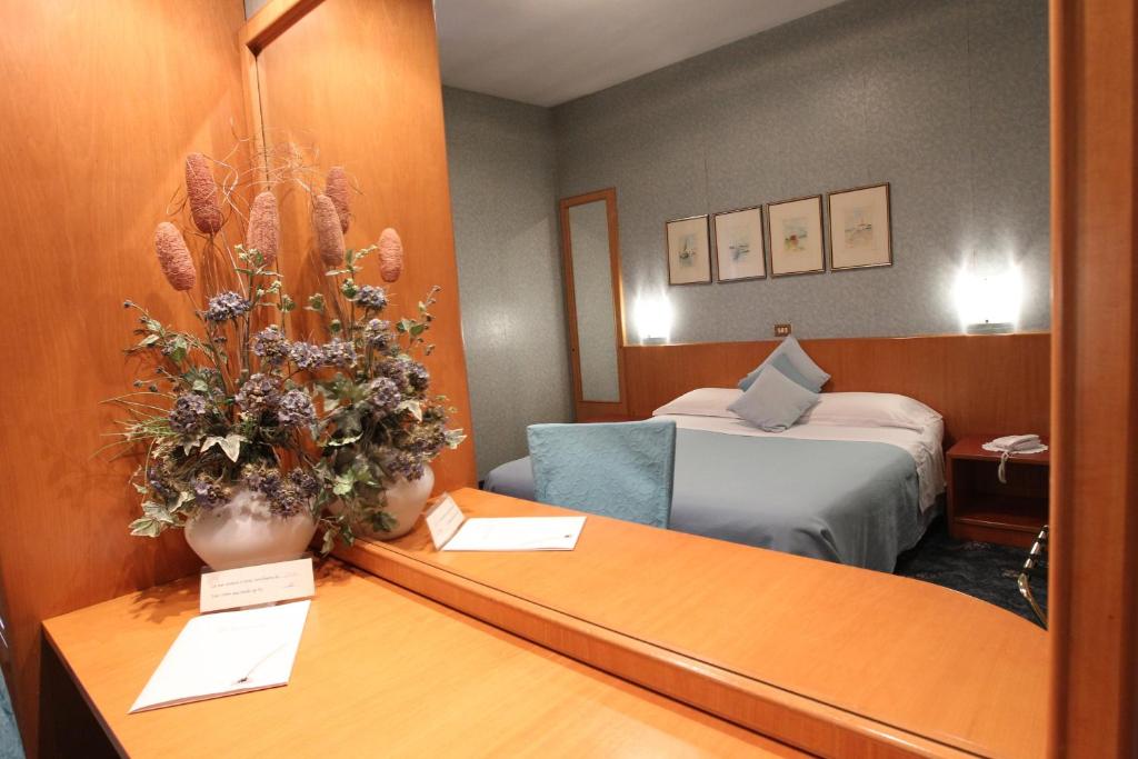 Postel nebo postele na pokoji v ubytování Hotel Globo