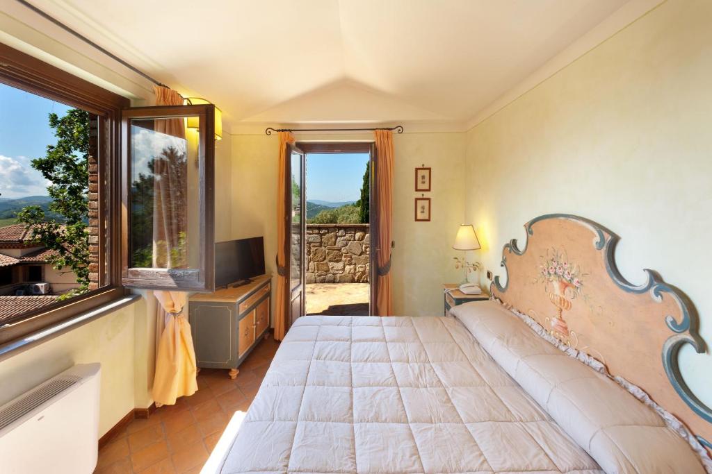 Postel nebo postele na pokoji v ubytování Relais Il Canalicchio Country Resort & SPA