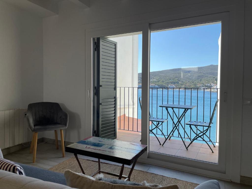 a living room with a view of the ocean at POAL-Dúplex de ensueño en Cadaqués in Cadaqués