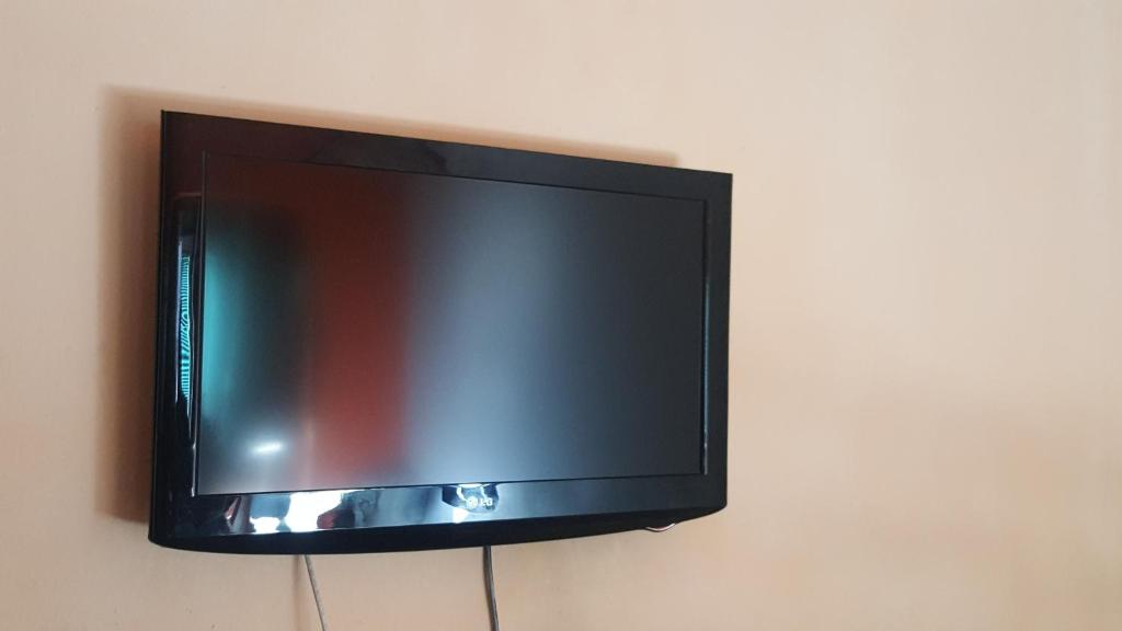 TV a/nebo společenská místnost v ubytování Vila De turist