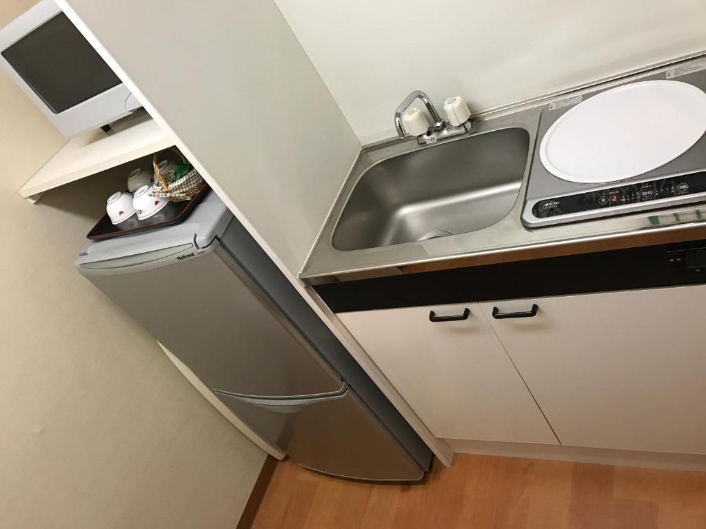 Kuchyň nebo kuchyňský kout v ubytování New Central Hotel Katsuta