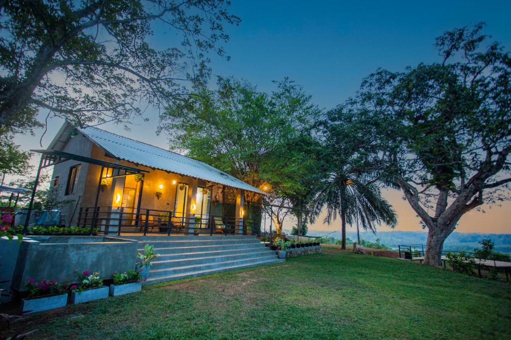 a house with a staircase leading up to it at Hill Top Legacy in Ambalangoda