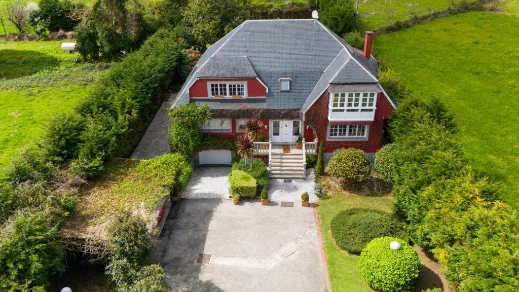 an aerial view of a red house with a driveway at Villa familiar - Jacuzzi - Children's Area in Bacoy