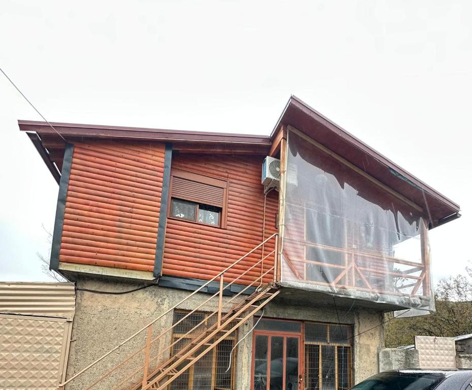 a house under construction with a balcony on it at Guesthouse Katerina in Përmet