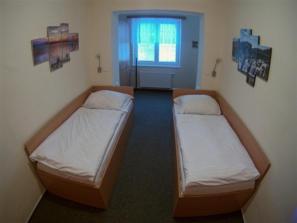 Postel nebo postele na pokoji v ubytování Chata Eliška