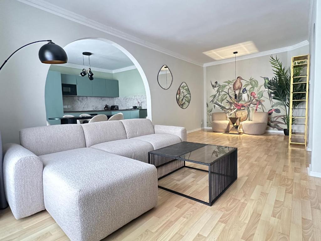 a living room with a couch and a table at Sunshine Apt in Central Sliema in Sliema