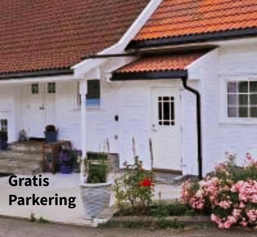 a white house with the words craftsyards paralleling at Highly recommended Apartment Trymsvei in Kristiansand